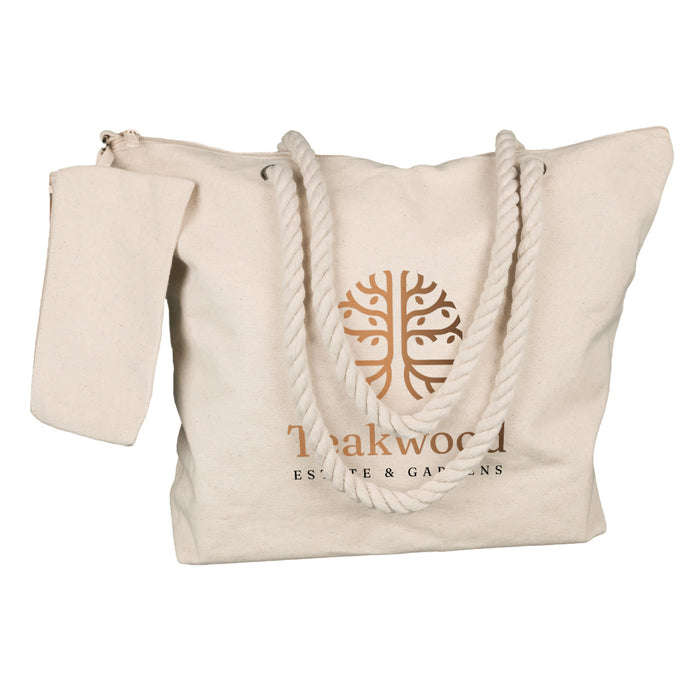 The Courtside Carry - A cream tote bag with a rope handle and a zippered pocket, featuring a logo on the front.