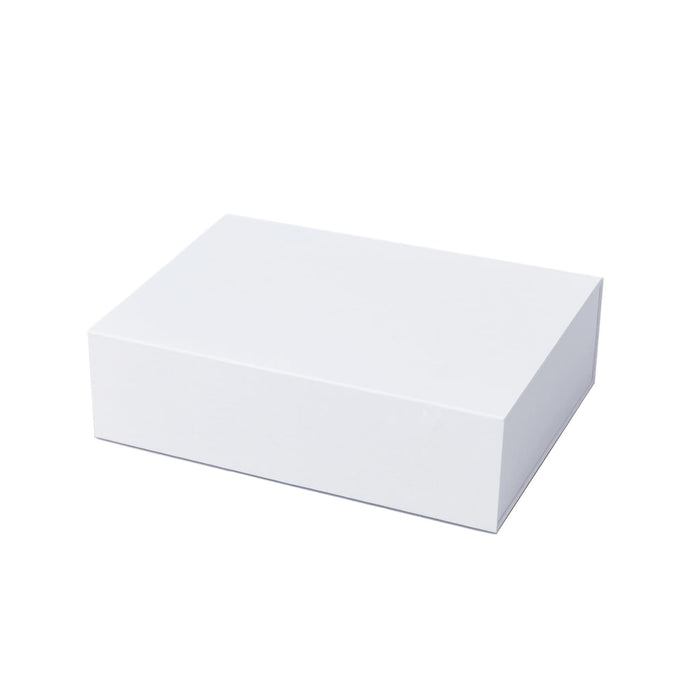 The Glow & Graze: Christmas Edition - A rectangular white box with a smooth surface, suitable for packaging or storage.