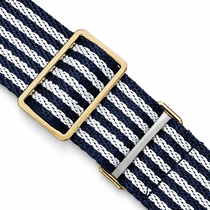 Pavilion Cooler by The Line Edit. - A navy and white striped belt featuring a gold buckle and silver metal detailing.