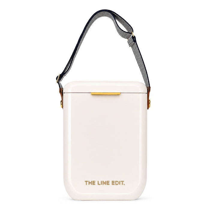 The Festive Edit Gift Set - A white insulated gift set with a gold accent and a striped shoulder strap. It features a logo on the front.