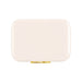 The Festive Edit Gift Set - A rectangular cooler in a sleek cream colour with a gold clasp and a logo.