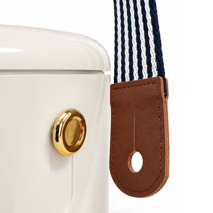 Pavilion Cooler by The Line Edit. - A white Pavilion Cooler with a gold knob and a blue and white striped strap, featuring a brown leather tag.