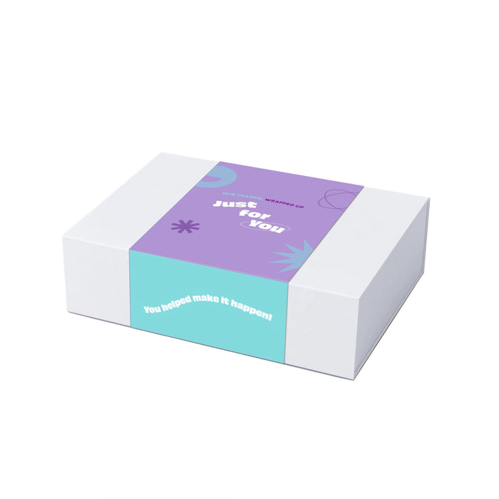 The Pamper & Entertain Edit - A gift box with a purple and turquoise design, featuring a logo and decorative elements.