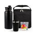 Daily Grind Pack - A drink bottle and a travel mug in matte black, alongside a cooler bag and a ziplock with assorted coloured gummies.