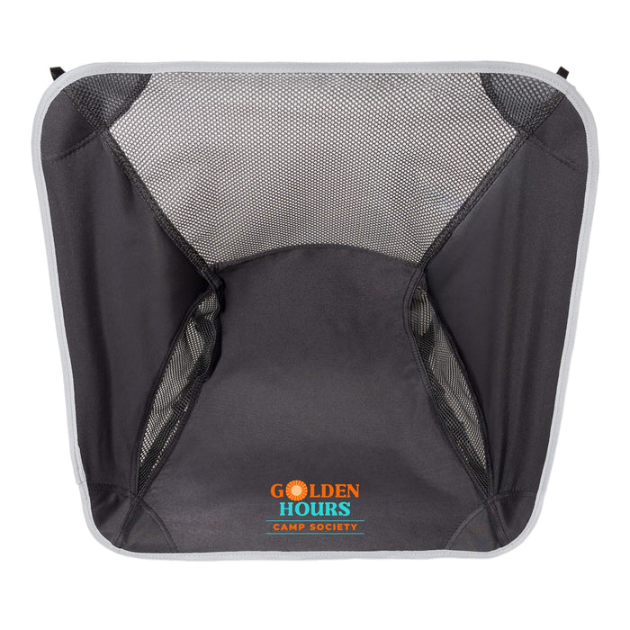 The Escape Pack - A collapsible camp chair in dark grey with mesh sides and a prominent logo at the centre.