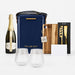The Pour & Gather Hamper - A navy hamper with a drink bottle, two crystal glasses, a wooden board, a corkscrew, and a card. It features branding.