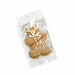 The Pause Pack: Christmas Edition - A gingerbread man cookie in a clear plastic package, decorated with white icing and a festive design.