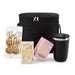 The Pause Pack: Christmas Edition - A black cooler bag containing drinking chocolate, gingerbread, marshmallow treats, and a black insulated drink bottle.