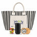 The Good Stuff Pack - A striped tote bag in black and white with a cream pocket, a jar of colourful sweets, a black drink container, and a wooden item.