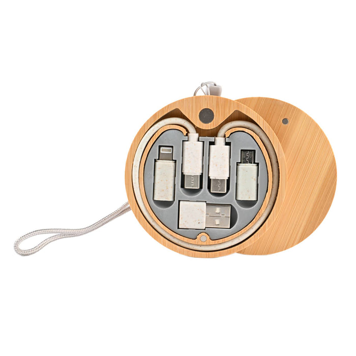 The Good Stuff Pack - A round wooden case contains various charger cables, including USB, Lightning, and Micro USB connections.