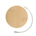 The Good Stuff Pack - A round bamboo product with a silver attachment cord, showcasing a natural wood finish.