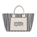 The Good Stuff Pack - A large striped tote bag in navy and cream, featuring a front pocket with a logo.