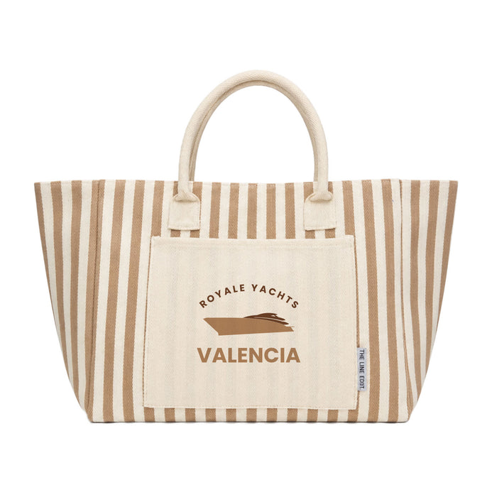 The Weekend Edit - A striped tote bag in beige and cream with a logo and a large front pocket.