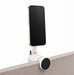 Tutor Maglock Phone Holder - A silver phone holder with a black circular base, securely attached to a surface, holding a smartphone.