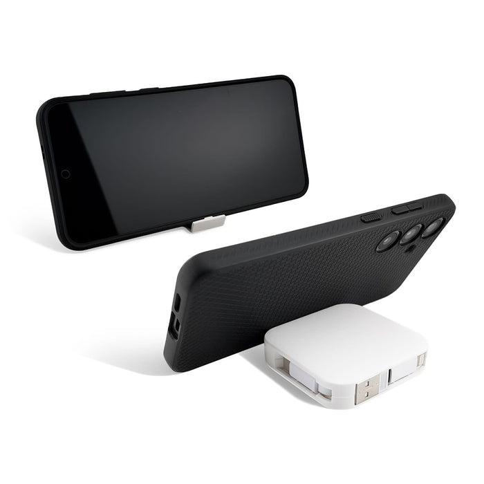 The Polished Traveller - A retractable charging cable in white, positioned beside a black smartphone case, featuring a sleek design and a logo.