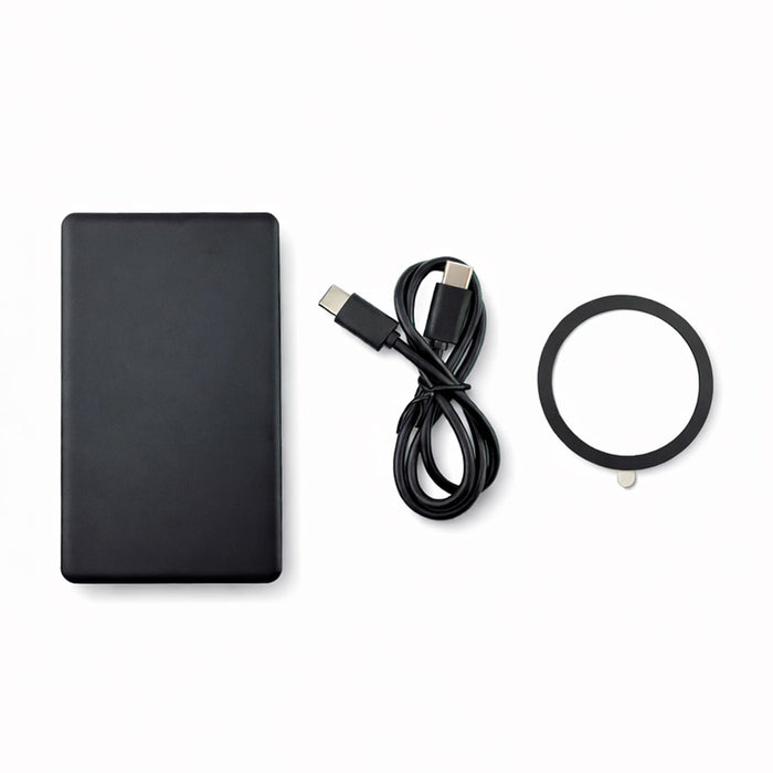 The Modern Essential Gift Set - A black solid state power bank, a USB-C cable, and a circular accessory. The product features a logo.