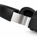 Aero by Nomis Headphones - Aero by Nomis headphones in black with a silver band and cushioned ear pads. Features a sleek design and branding.