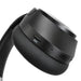 Aero by Nomis Headphones - A pair of black wireless headphones featuring buttons for noise cancellation and USB-C charging.