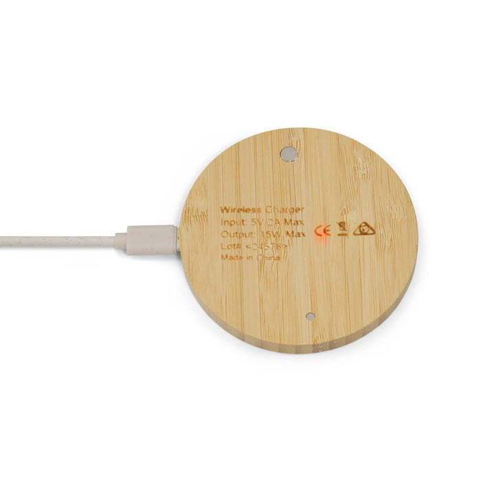 Reveal Circle Wireless Charger Set - A round bamboo wireless charger with a white charging cable connected. It features a minimal design and has a logo.