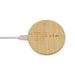 Reveal Circle Wireless Charger Set - A round bamboo wireless charger with a white charging cable connected. It features a minimal design and has a logo.