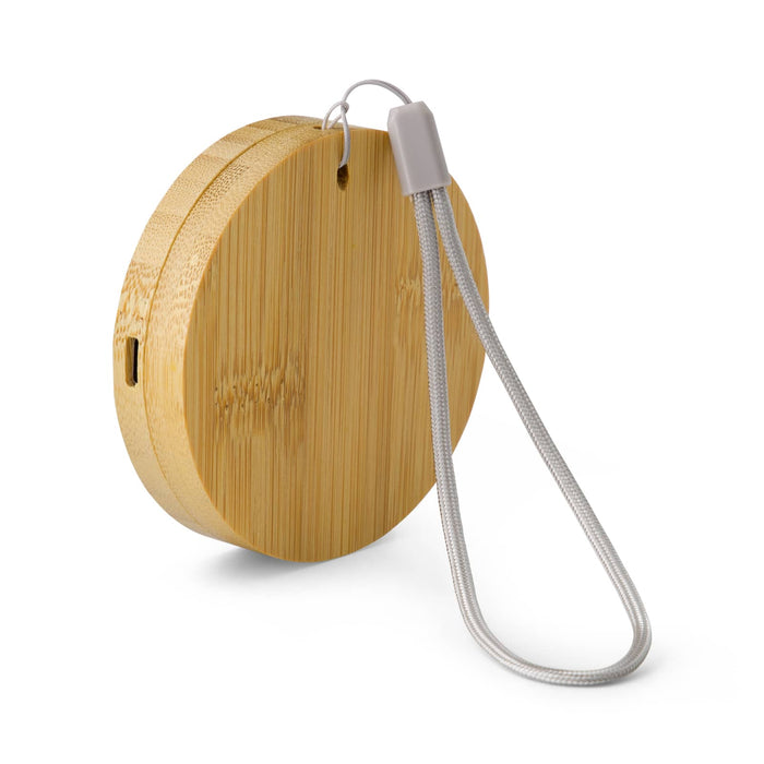 Reveal Circle Wireless Charger Set - A round bamboo wireless charger with a grey strap, featuring a small port for connection.