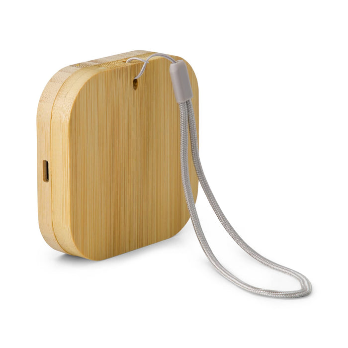 Reveal Square Wireless Charger Set - A bamboo wireless charger with a silver strap, featuring a sleek, rounded design and a charging port.