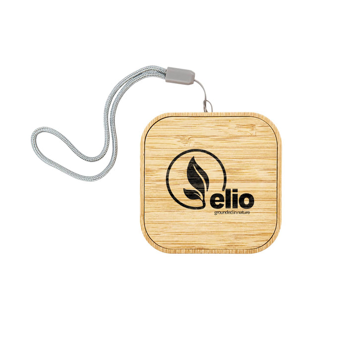 Reveal Square Wireless Charger Set - A square bamboo wireless charger with a silver strap and a logo.