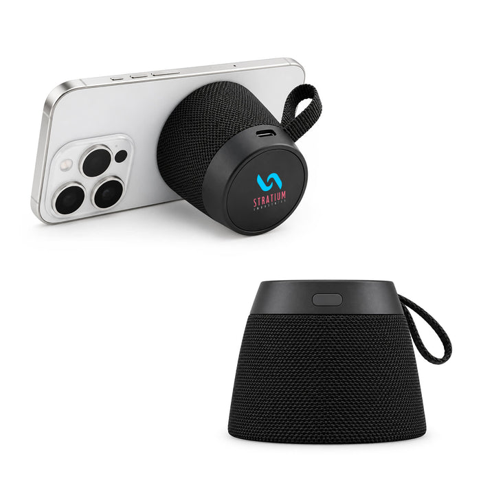 Empire Maglock Ph Stand Speaker - A black portable speaker with a fabric design, displayed with a phone leaning against it. Features a logo.