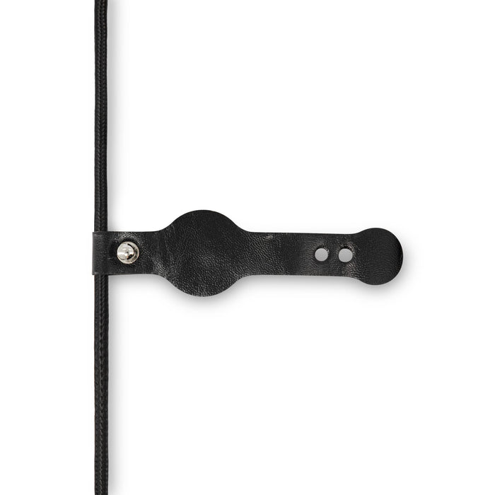 Aura by Nomis Cable - A black charging cable with a leather strap for organisation, featuring a logo on the strap.