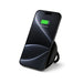 Puck Magnetic Phone and Watch Charger with Stand - A black magnetic phone and watch charger with stand, featuring a sleek design and a phone displaying a charging status.