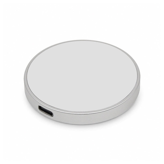 Puck Magnetic Phone and Watch Charger with Stand - A silver circular wireless charger with a USB-C port, featuring a smooth surface and simple design.