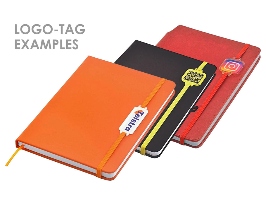 Essentials A5 Notebook - Three A5 notebooks in orange, black, and red, each featuring a logo tag and an elastic band closure.