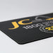 Fabric Mouse Mat (225mm x 185mm) - A fabric mouse mat in black with yellow accents and a logo. The dimensions are 225mm x 185mm.
