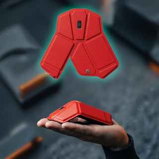 Stealth Foldable Wireless Mouse - A red foldable wireless mouse resting in a hand, showcasing its compact design and modern aesthetics.