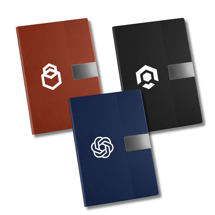 Vienna Notebook A5 - Three A5 notebooks in brown, black, and dark blue, each with a logo and a textured design on the cover.
