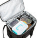 Large Nylon Cooler Bag - A large black nylon cooler bag with silver interior, containing various containers of food and fruit.