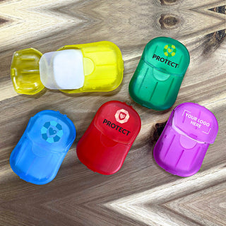 Soapy - A collection of small, colourful containers in yellow, green, red, blue, and purple, featuring various logos and branding.