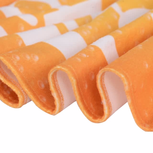 Bath Towel - An orange and white patterned face washer with soft, curled edges, featuring a towel-like texture.