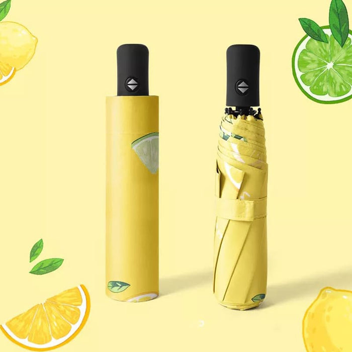 Full Colour Poppins Umbrella - A yellow umbrella with a lemon and lime design, featuring a black handle and a matching storage sleeve.