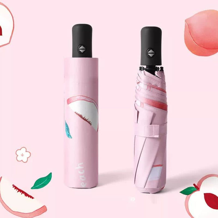 Full Colour Poppins Umbrella - A pink umbrella with a peach design, displayed both open and in its case, featuring a black handle and branding.