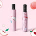 Full Colour Poppins Umbrella - A pink umbrella with a peach design, displayed both open and in its case, featuring a black handle and branding.