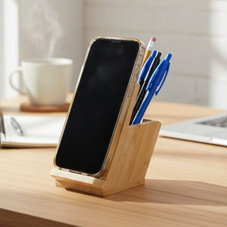 Bamboo Mobile Stand and Pen Holder - A bamboo mobile stand and pen holder featuring a space for a smartphone and several blue and black pens.