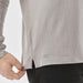Men's Nevada L/S Micro Pique Polo - A grey long-sleeve polo shirt with a side slit, featuring a small logo near the hem.