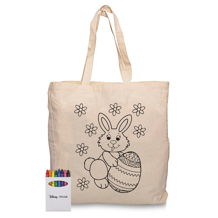 Squiggle Calico bag + Crayon set - A cream calico tote bag with a bunny design and a set of colourful crayons beside it. Features a brand logo.