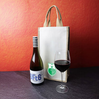 Jute Double Wine Bag - A jute double wine bag in natural colour alongside a bottle of wine and a glass of red wine. The bag has a logo.