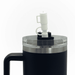 The Hippo 1.2L Mug - A drink bottle featuring a black exterior, clear lid, and a white nozzle, along with a handle and logo.