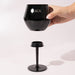 Shiraz Detachable Wine Glass - A black Shiraz Detachable Wine Glass with a removable stem, featuring a logo on the cup.
