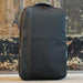 Swissdigital Arosa Backpack - A sleek black backpack with a textured finish and a branding logo on the front.