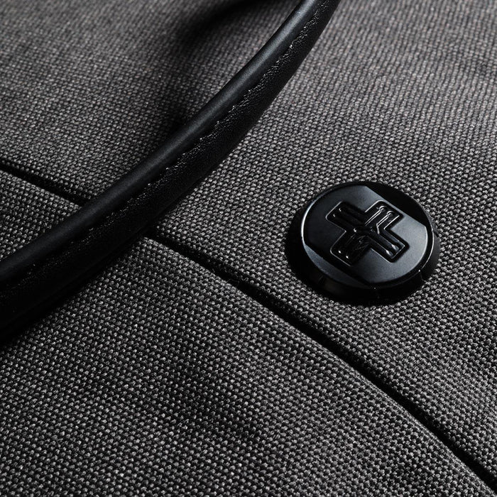 Swissdigital Arosa Tote Bag - A grey tote bag with a black handle and a circular black logo on the front.