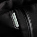 Swissdigital Arosa Tote Bag - A black tote bag with a zipper and a prominent logo tag features a sleek, minimalist design.